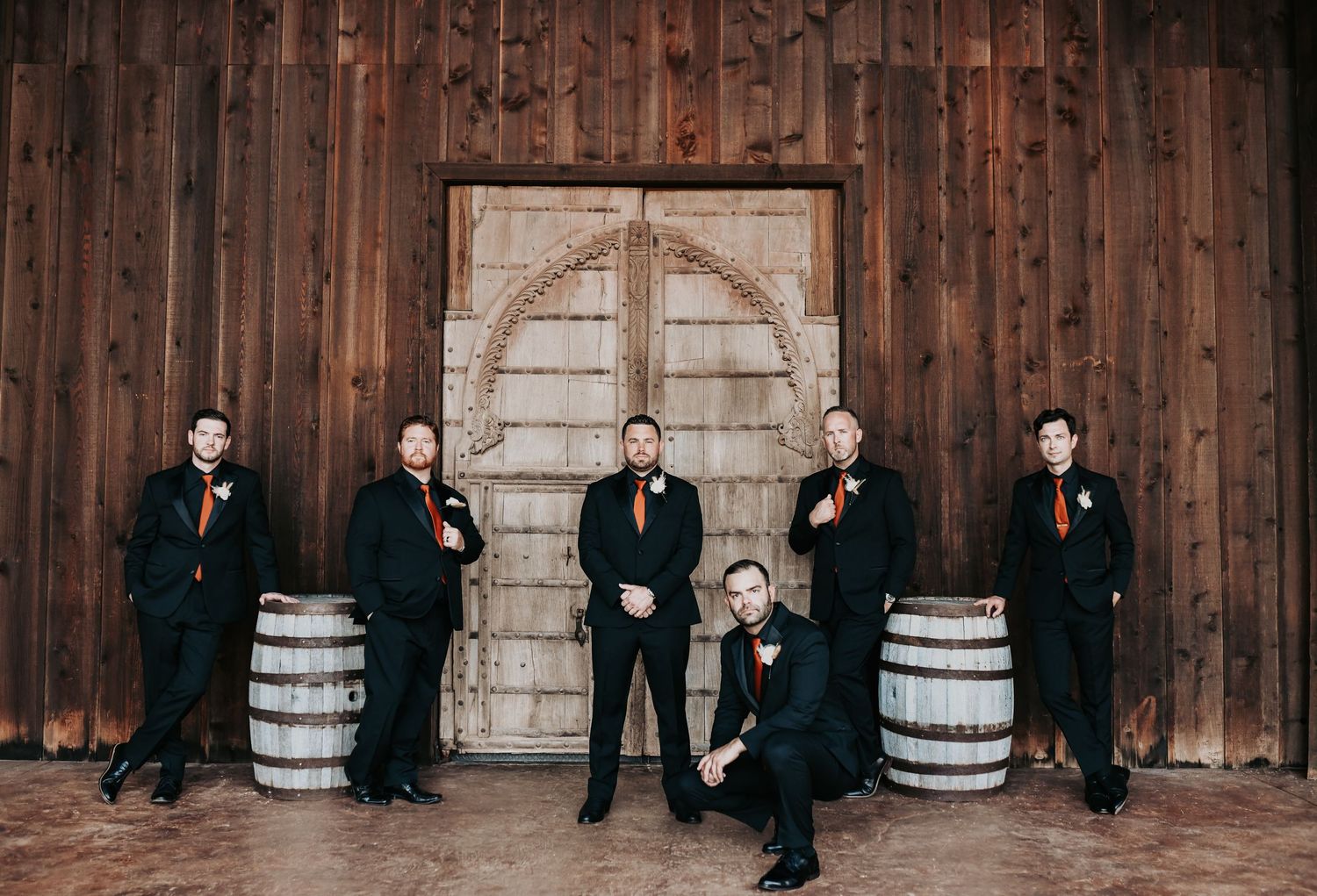 Groom and groomsmen posing together at Lucky Spur Ranch