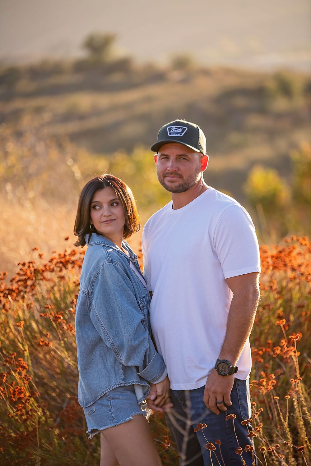 Lifestyle anniversary portrait of a couple sharing a candid moment at sunset in Yucaipa CA.