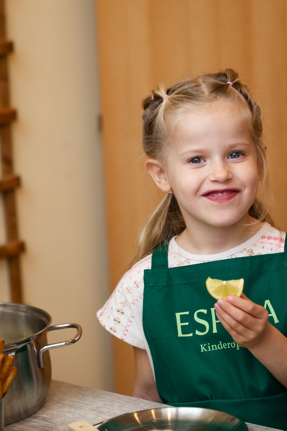 A series of close-up shots showing someone wearing a green apron while cooking or baking.