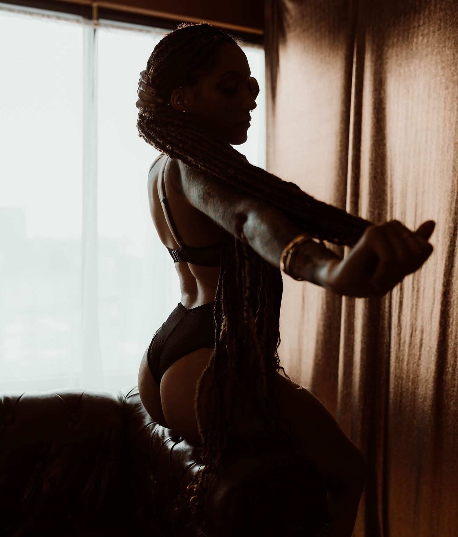 woman in studio showing Boudoir Photography Without The Downtown Drive
