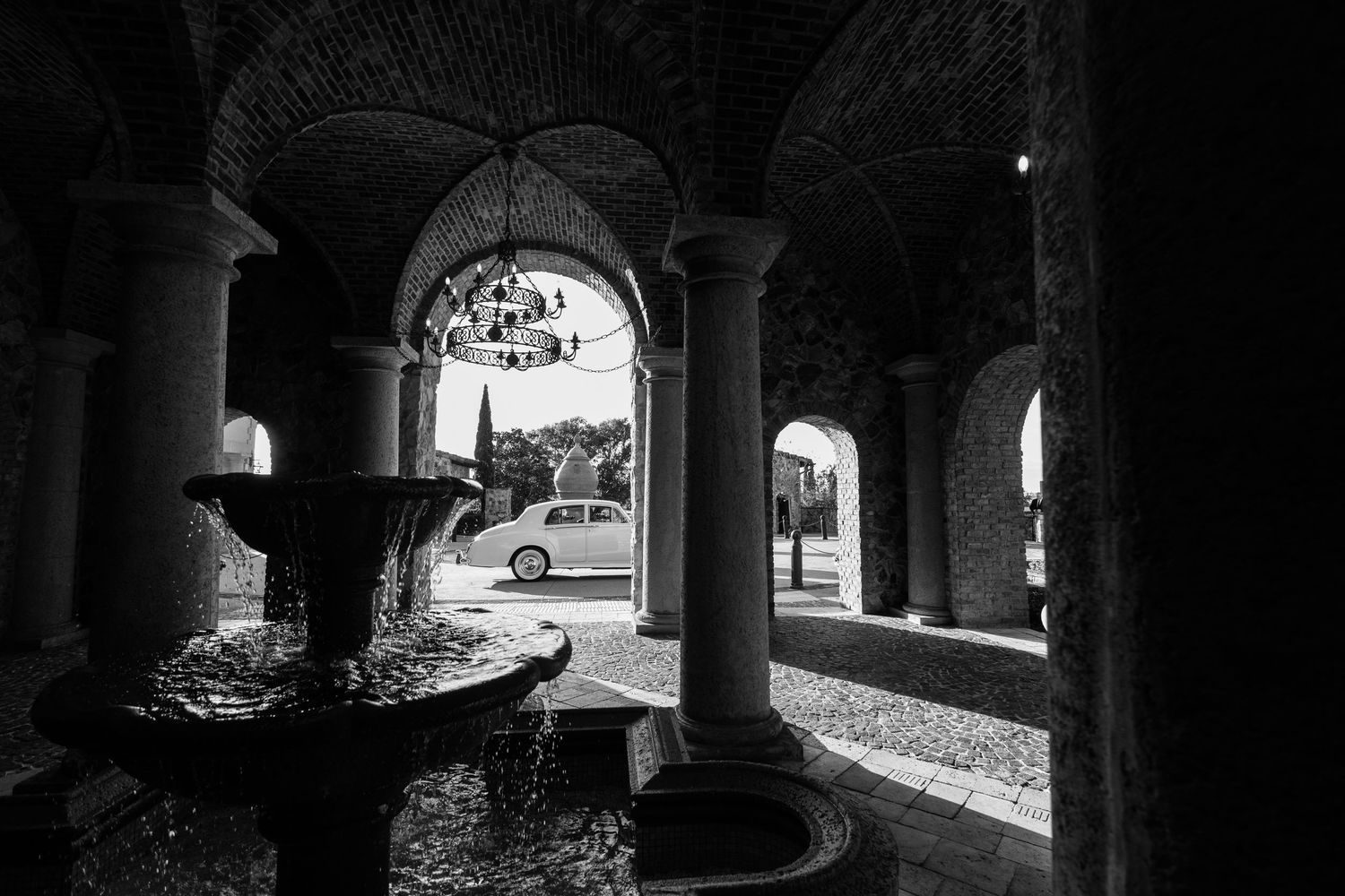 Bella Collina fountain archway Rolls Royce wedding black and white Montverde Florida Weddings by Ray
