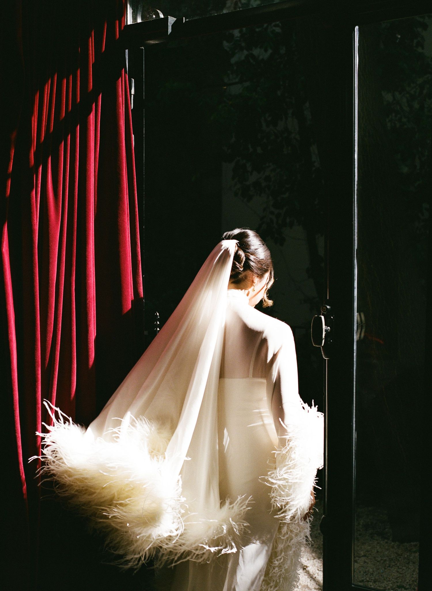 Bride in feather-trimmed veil and white gown in Paris, Paris fashion bride, Paris wedding venues, Paris film weddings, paris film photograph