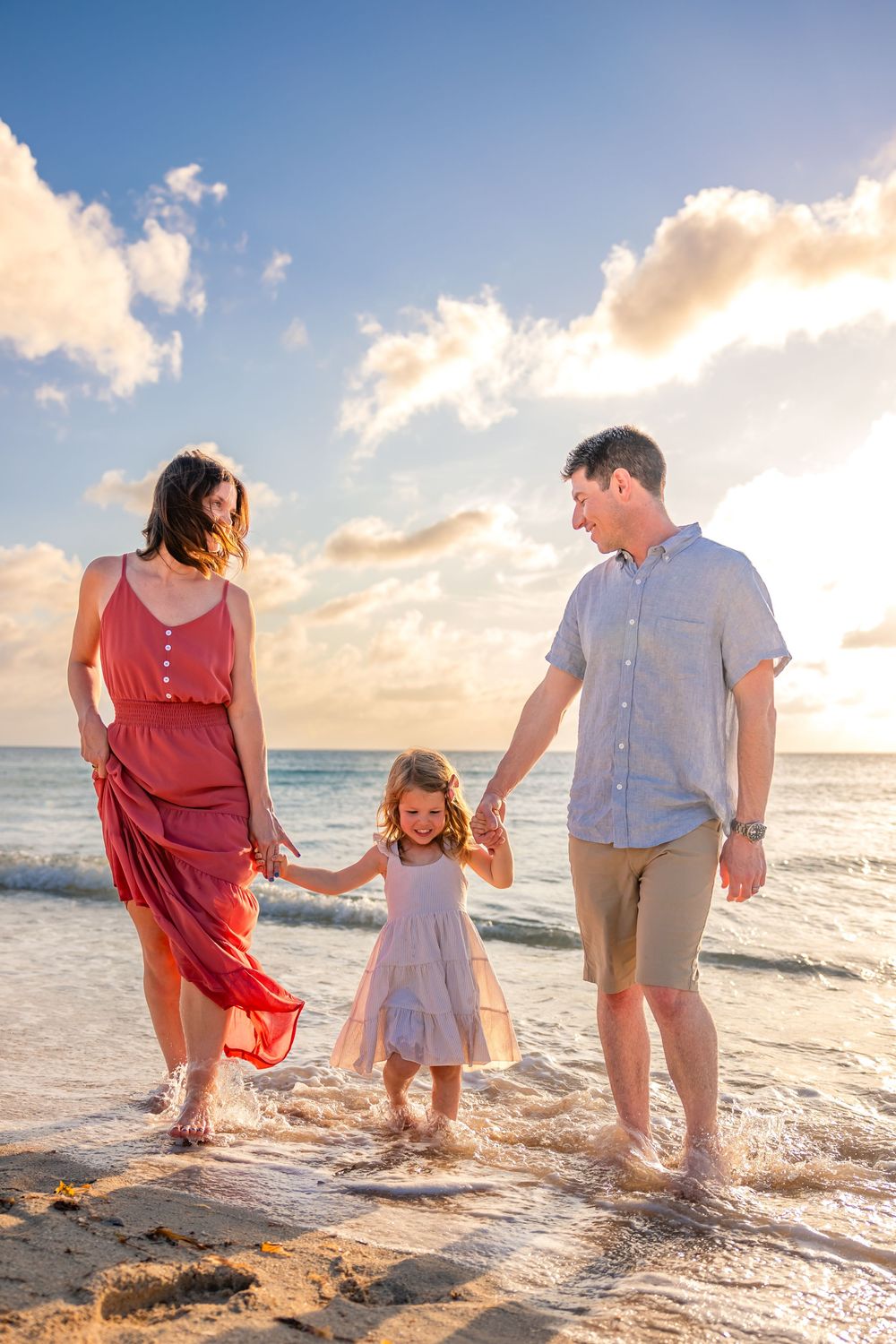 Family walking together during a beach photoshoot in Cozumel
