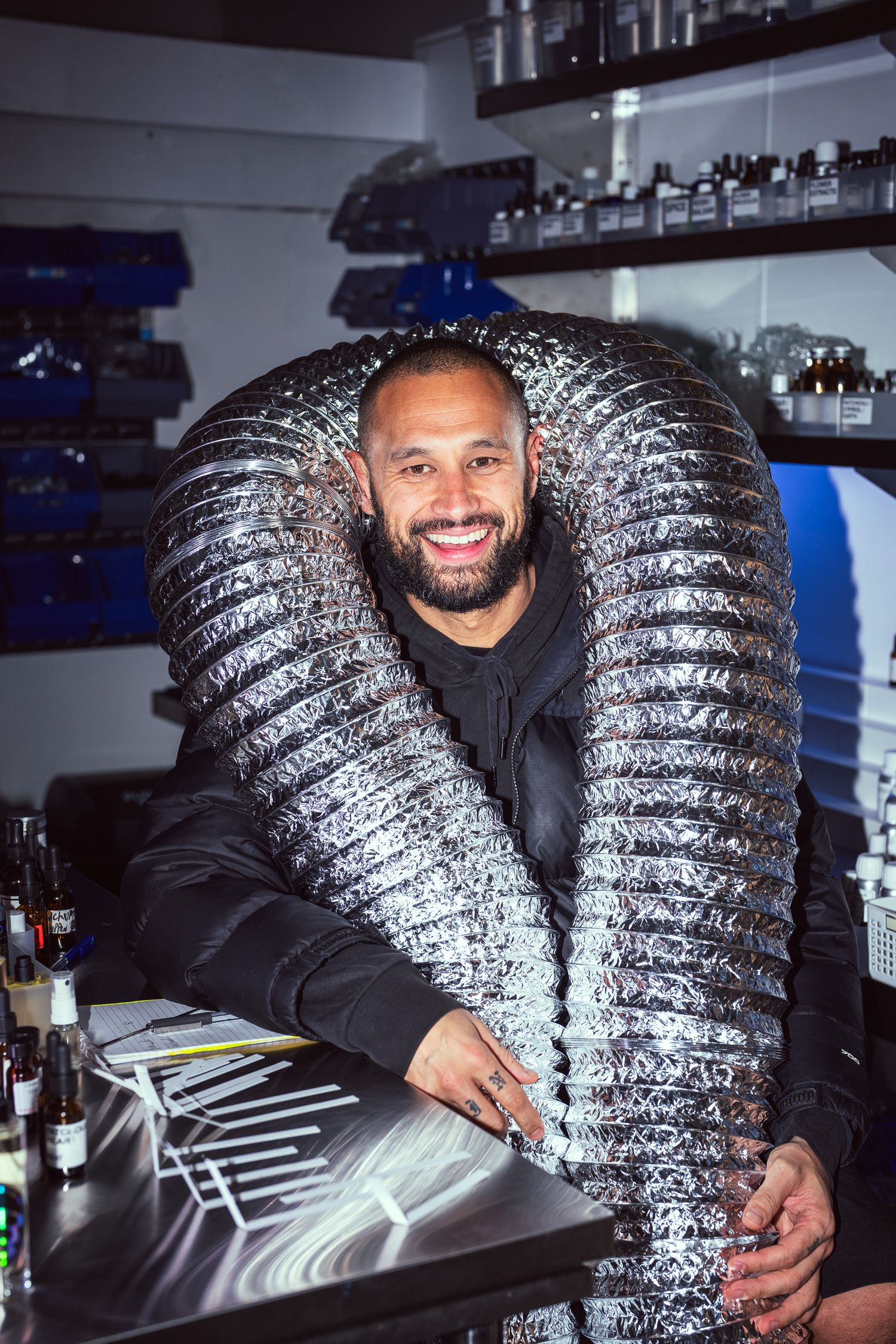 A fun portrait of Nate, wearing ventilation tubing in his laboratory