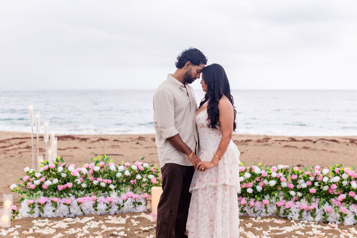 Marriage proposal on the beach with flowers and candles. Playa Guajataca, Isabela, Puerto Rico.