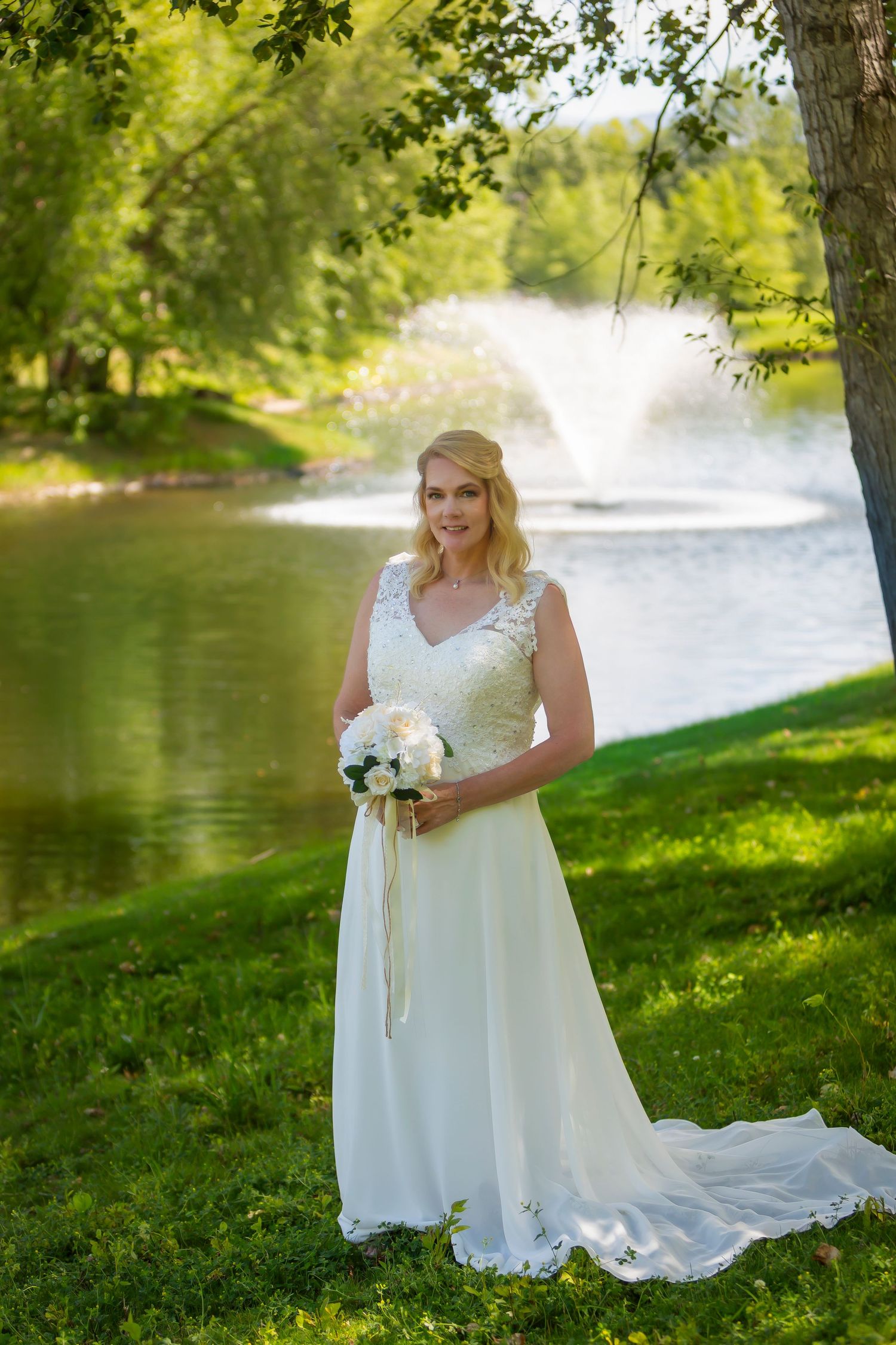 Bridal portrait in front of pond with water feature Boise Elopement ©Milestones Studios LLC