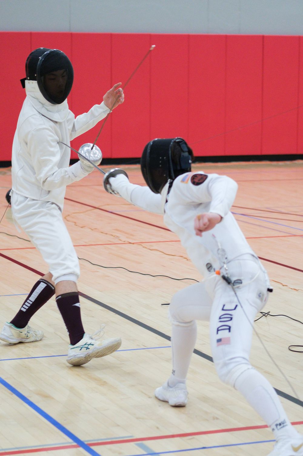 Members of the Fencing Club at Northern Illinois University in Dekalb, IL participate in a fencing tournament against other schools.