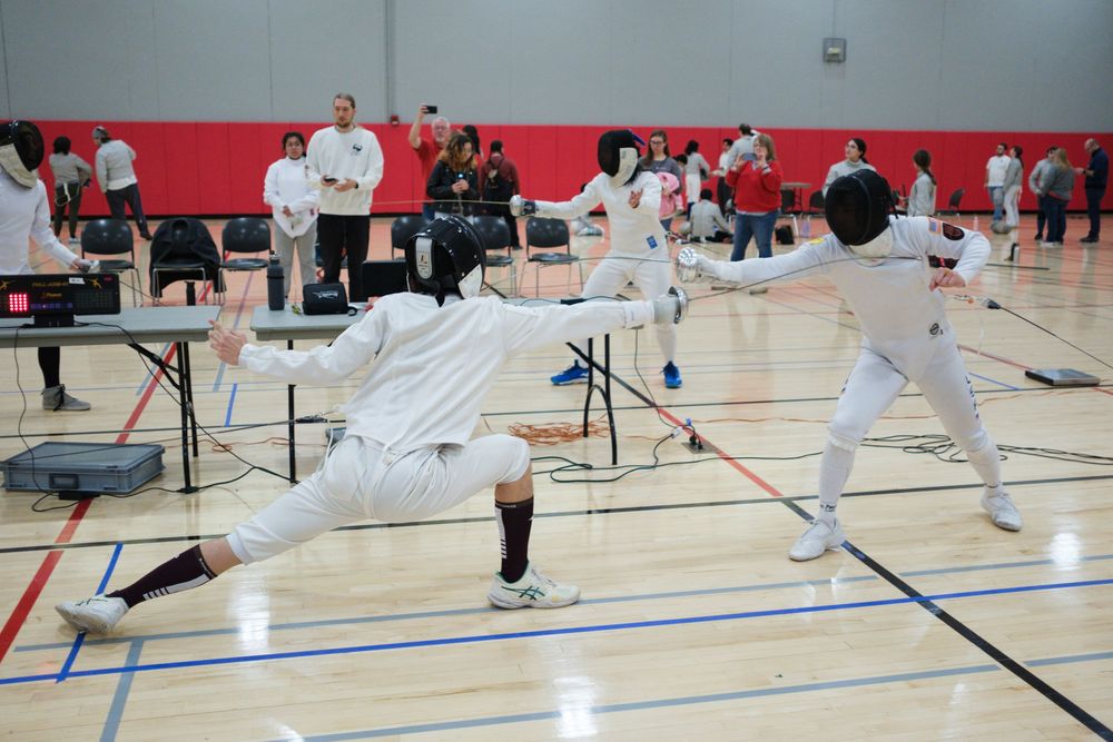 Members of the Fencing Club at Northern Illinois University in Dekalb, IL participate in a fencing tournament against other schools.