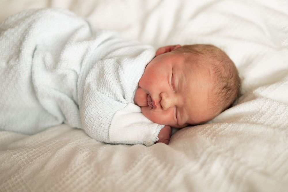 Peaceful newborn baby sleeping at Parkwest Medical Center in Knoxville, TN.