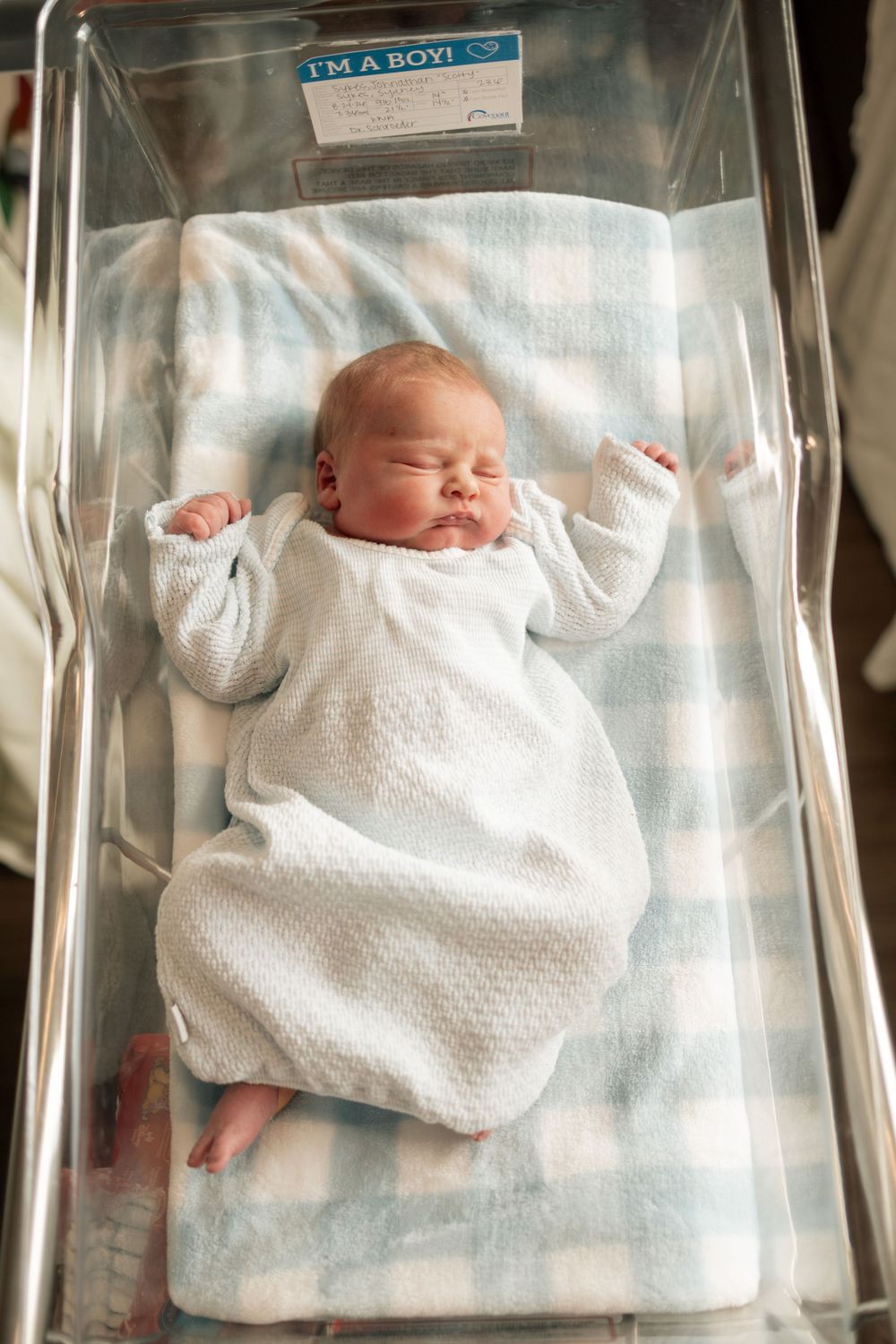 Newborn baby boy sleeping peacefully in hospital bassinet at Parkwest Medical Center in Knoxville, TN.