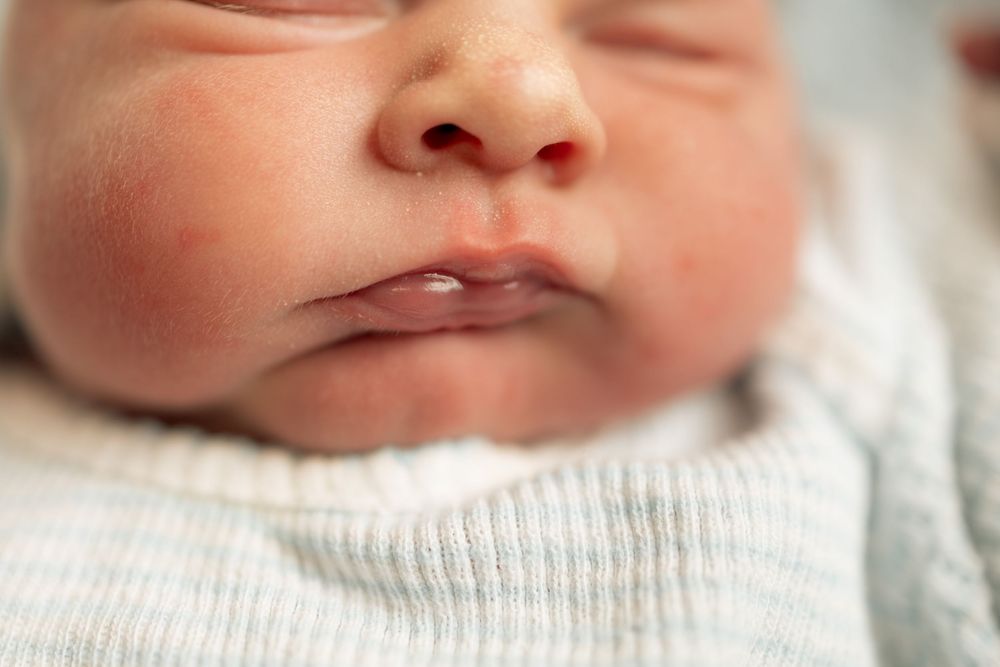 Close-up of a sleeping newborn baby with soft skin at Parkwest Medical Center in Knoxville, TN.