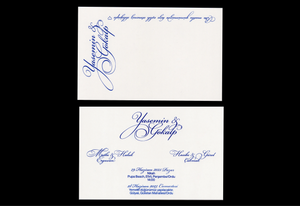 Classic white wedding invitation with blue calligraphy script for Yasmin and Yakup.