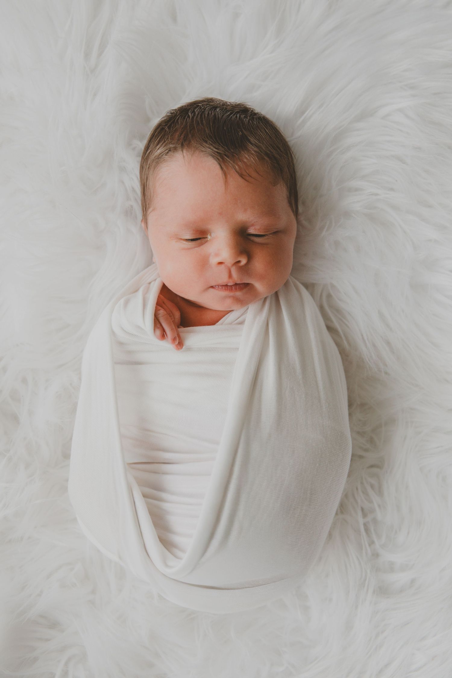 beautiful newborn baby daughter. Joyous. Family newborn photo session