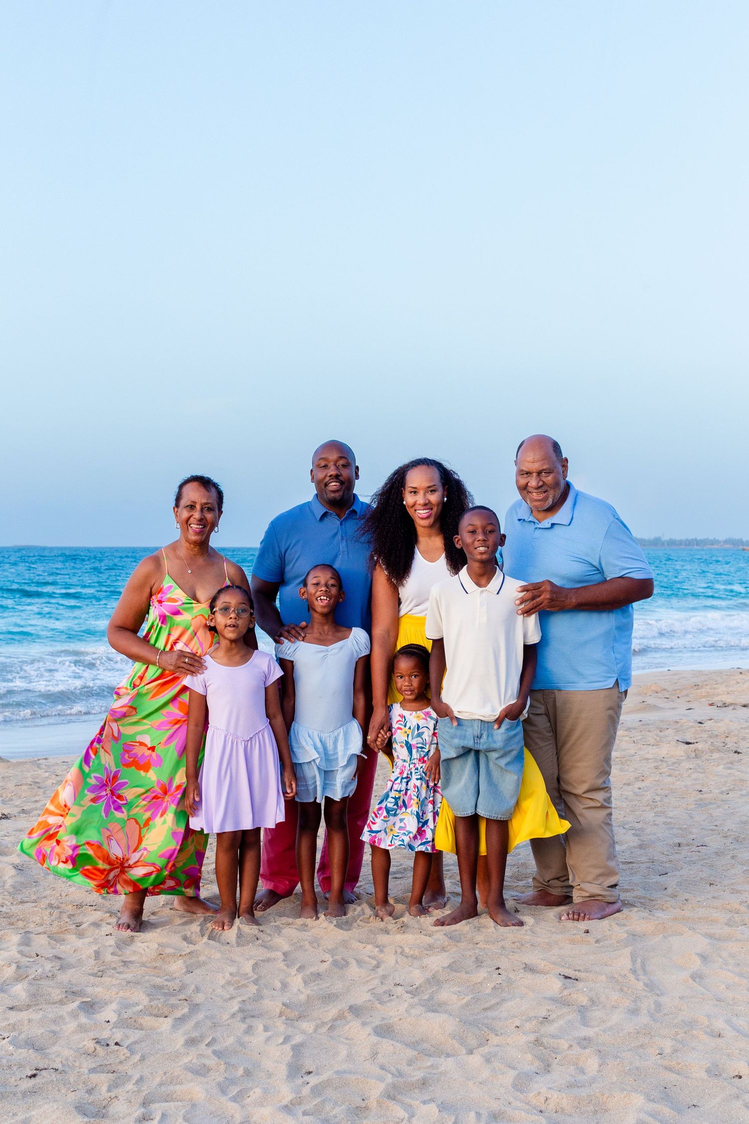 Family portrait. Mom, dad, four kids and grandparents on the beach in Isla Verde, Carolina, Puerto Rico.