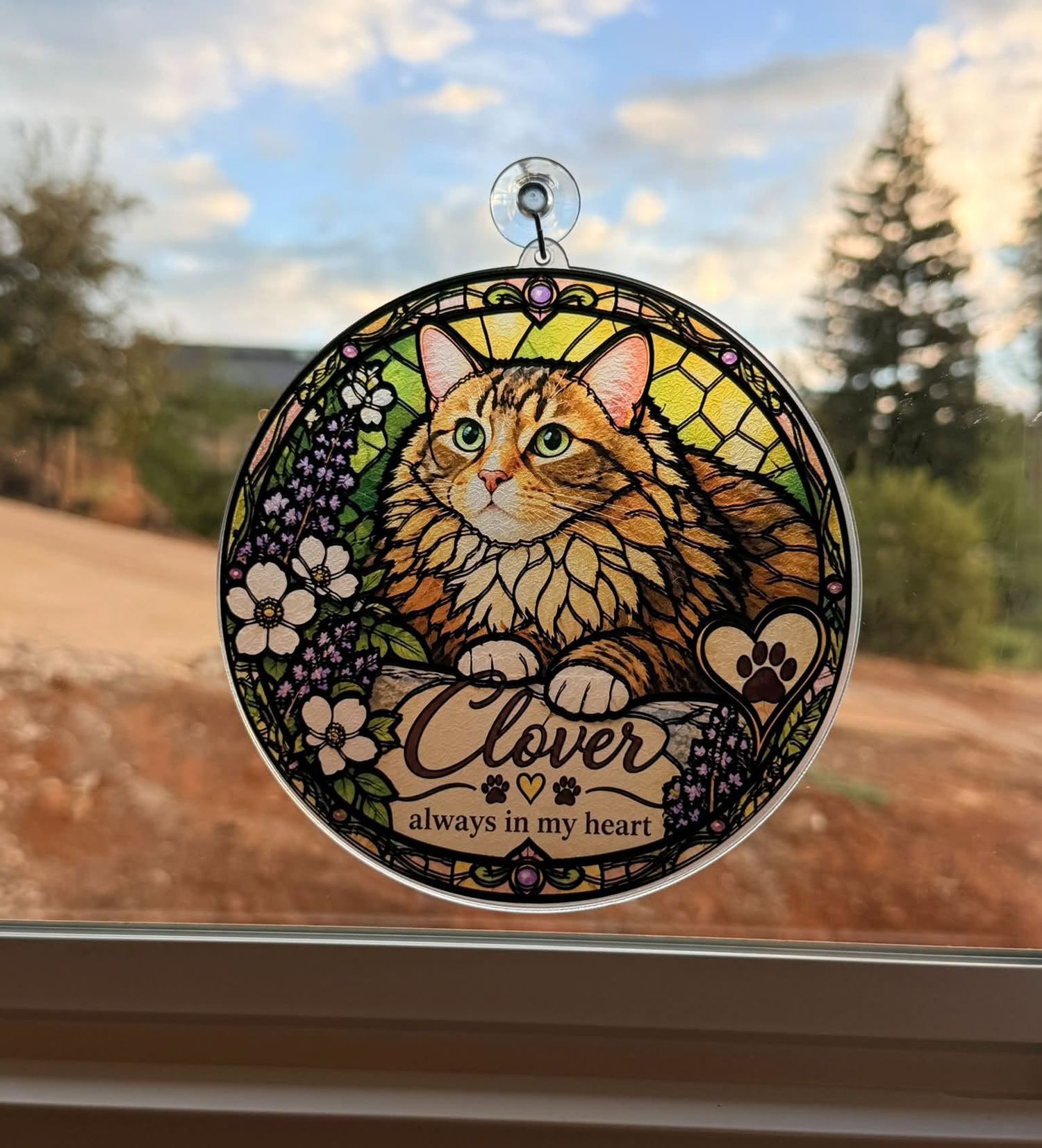 Stained glass style suncatcher memorial ornament featuring an orange tabby cat named Clover with floral design.