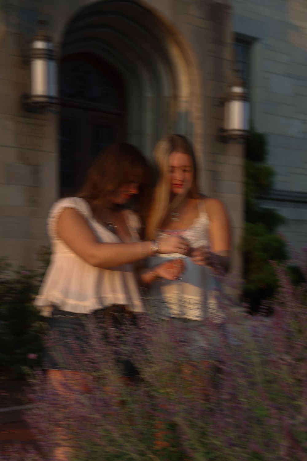 Two women looking at flowers together