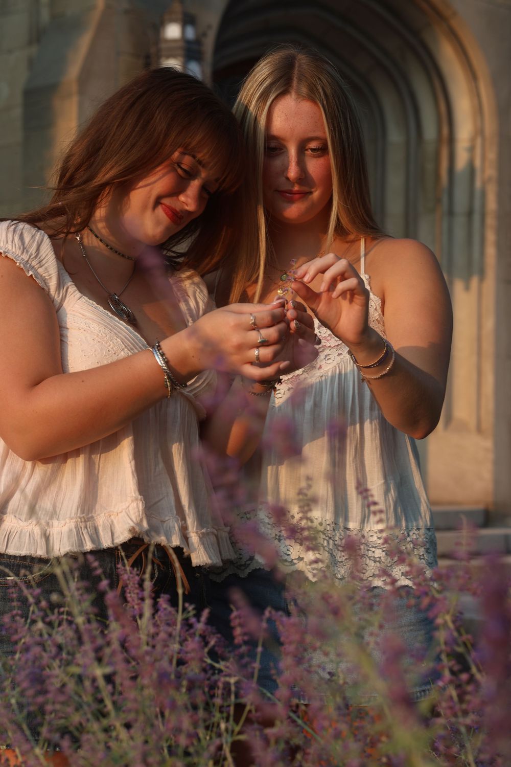 Two women admiring flowers together