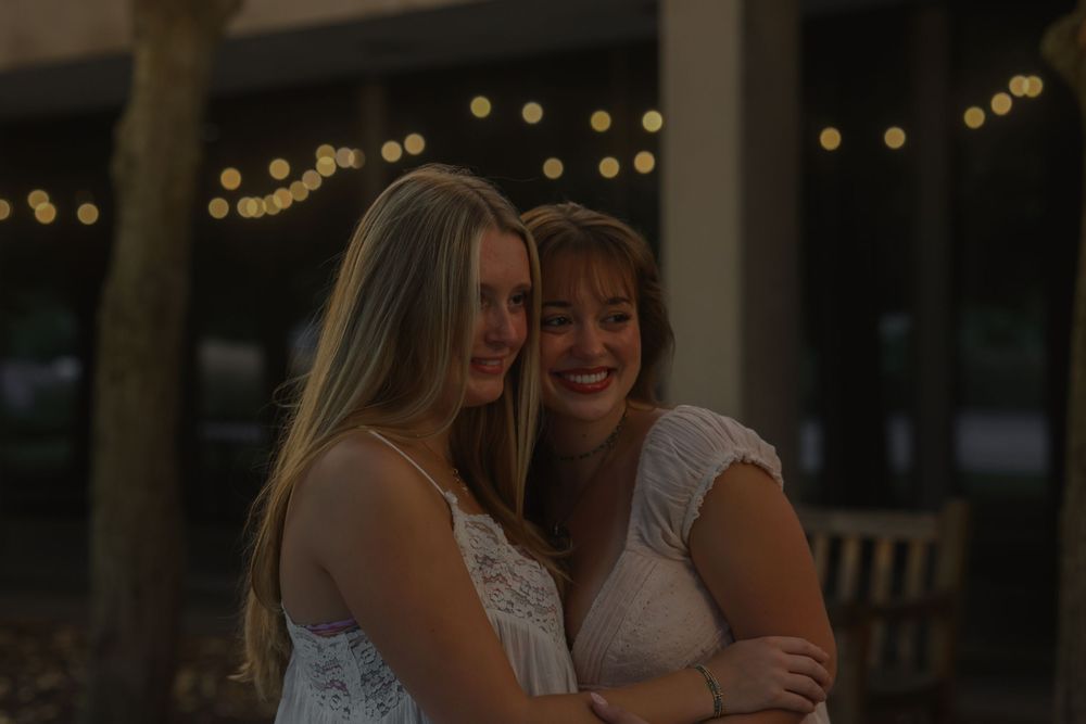 Two women hugging and smiling
