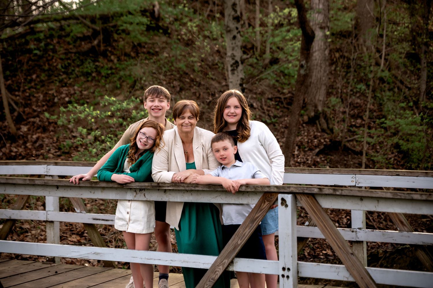 Grandmother and four grand children hugging during family session at Tawawa Park in Sidney Ohio