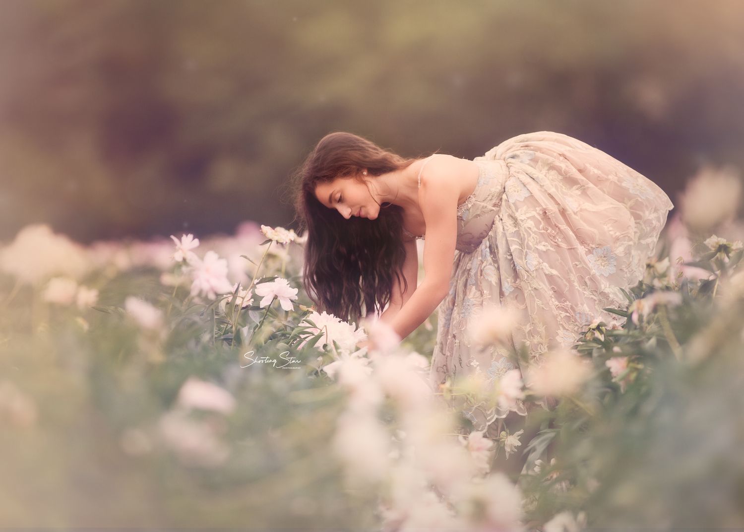 Teen portrait surrounded by blooming peonies in a colorful New Jersey flower field.