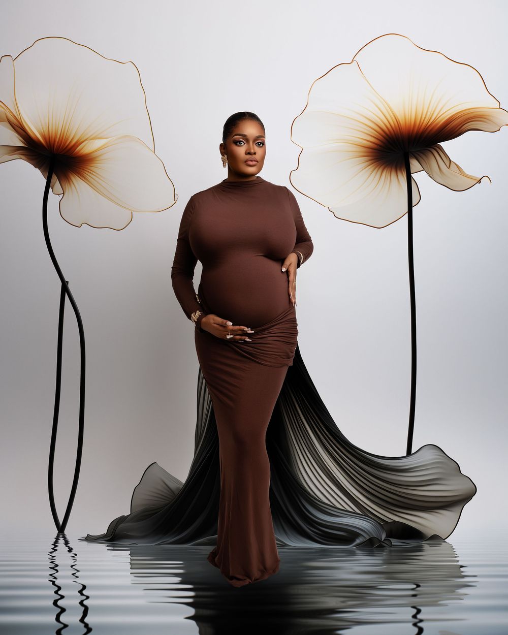 Pregnant woman in a dress holding baby bump, studio session in Wolverhampton