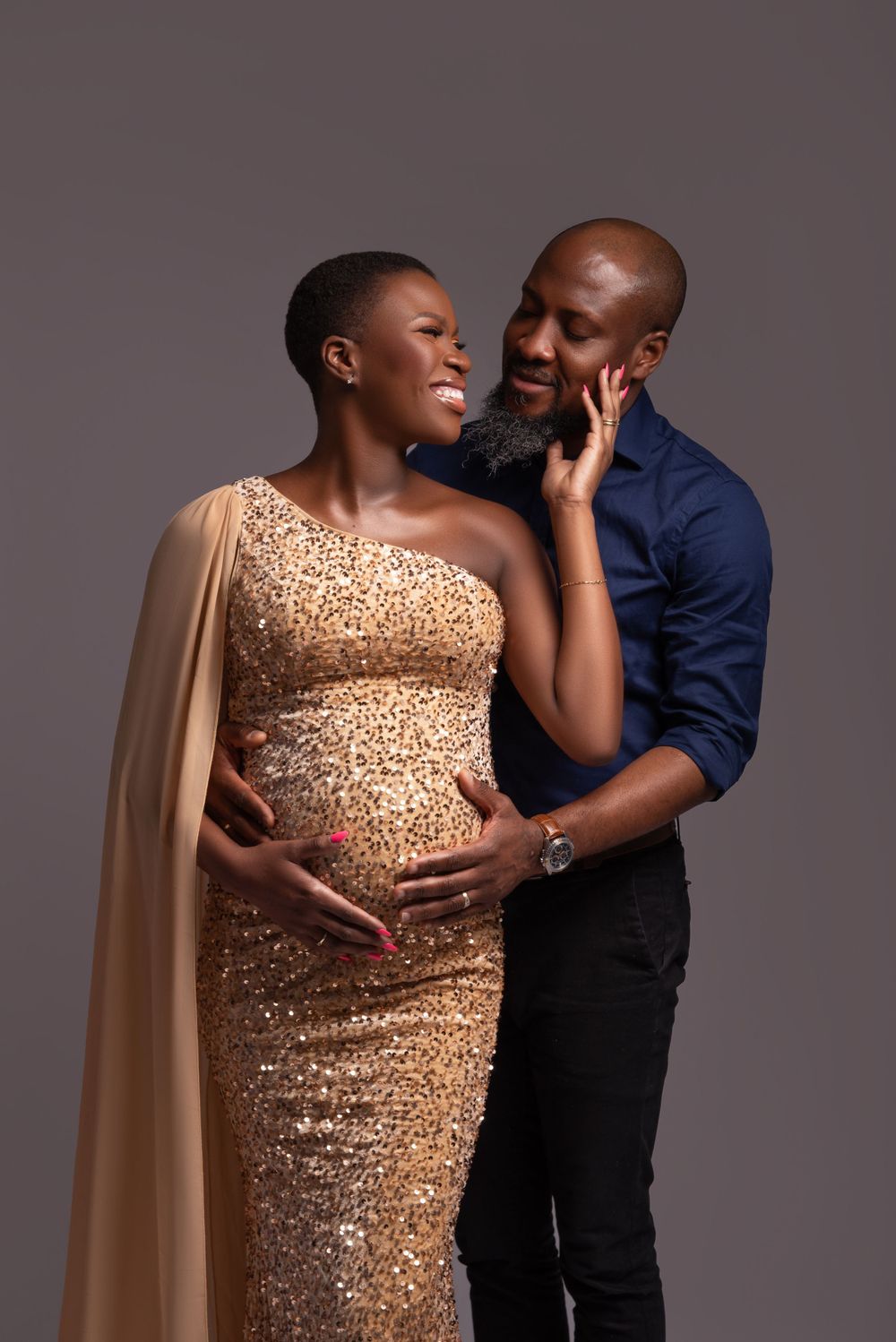 Expecting parents hugging during maternity shoot, Wolverhampton and Birmingham