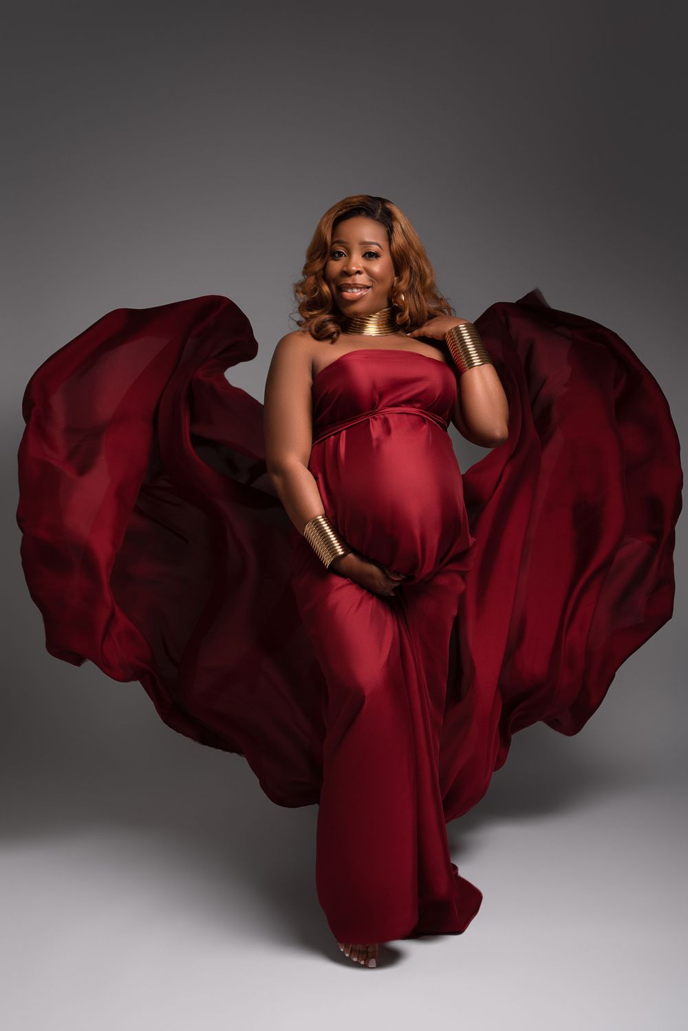 pregnant woman in flowing dress maternity portrait