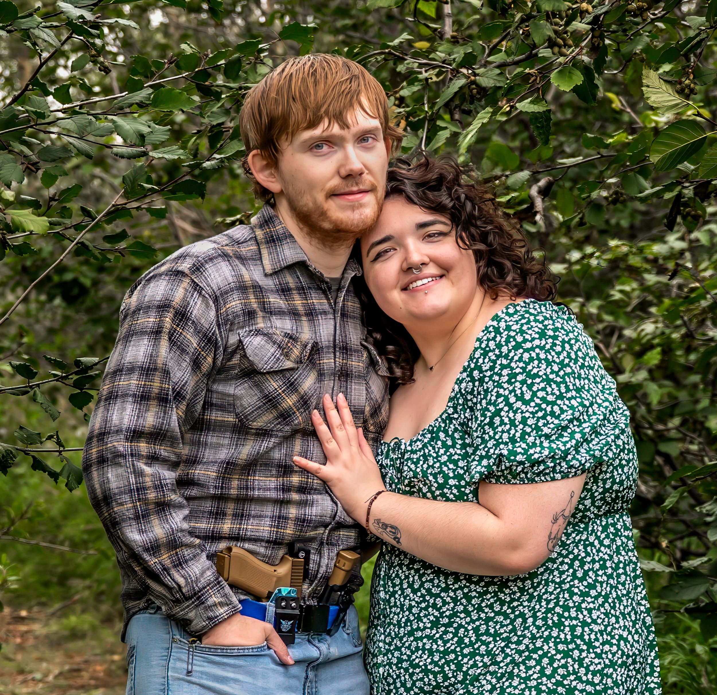 A couple in plaid and green prints share joyful moments outdoors among lush greenery in a casual photo series.