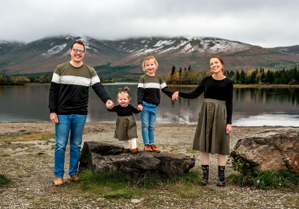A panoramic collage of scenic mountain landscapes with rugged terrain and natural vistas in muted tones.