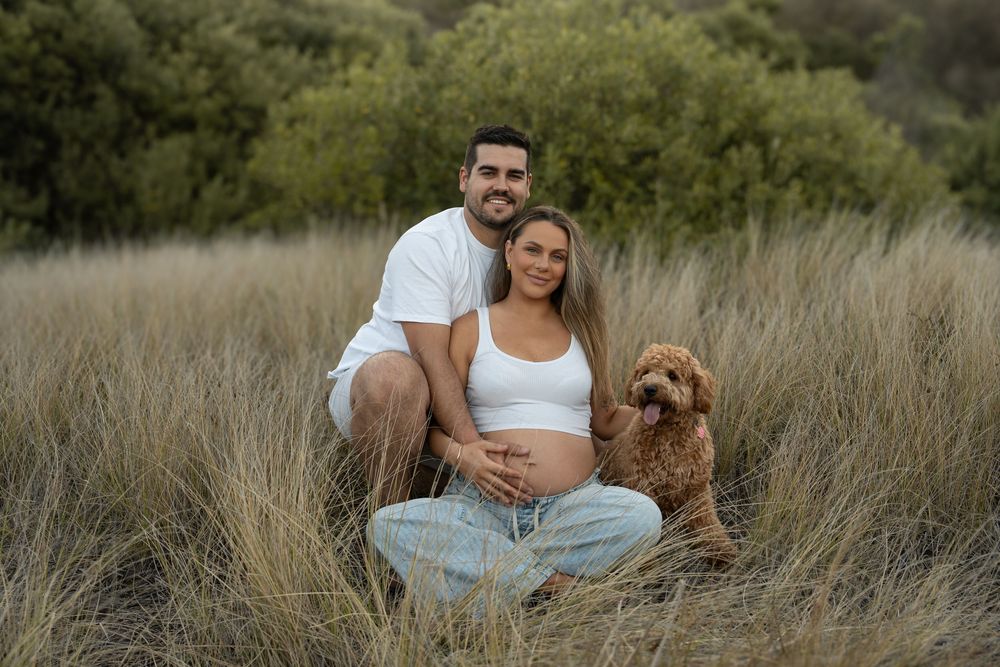 motional maternity shoot with husband and wife holding baby bump.Illawarra photography.