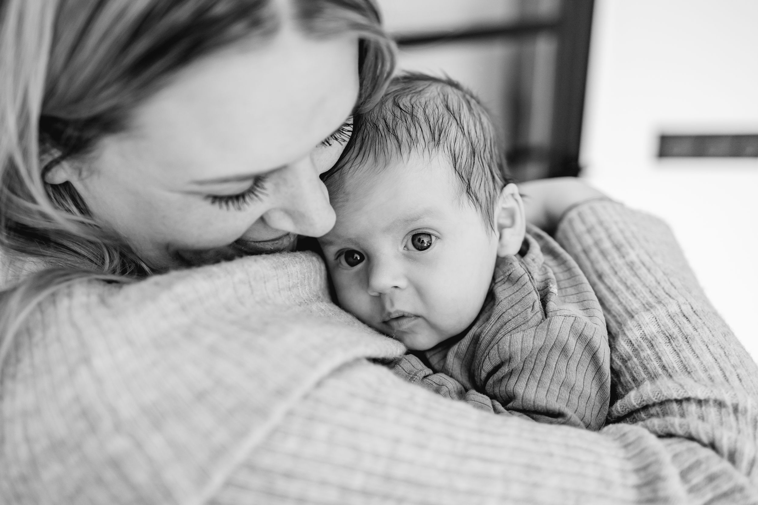 Tender black and white series showing gentle embraces and quiet moments.