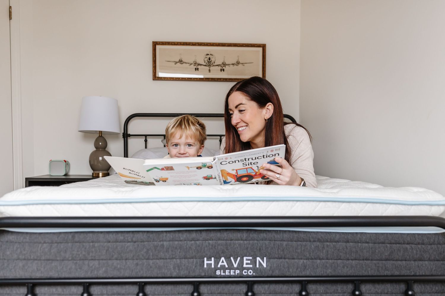 Family testing out a Haven mattress in a bright, modern bedroom setting.