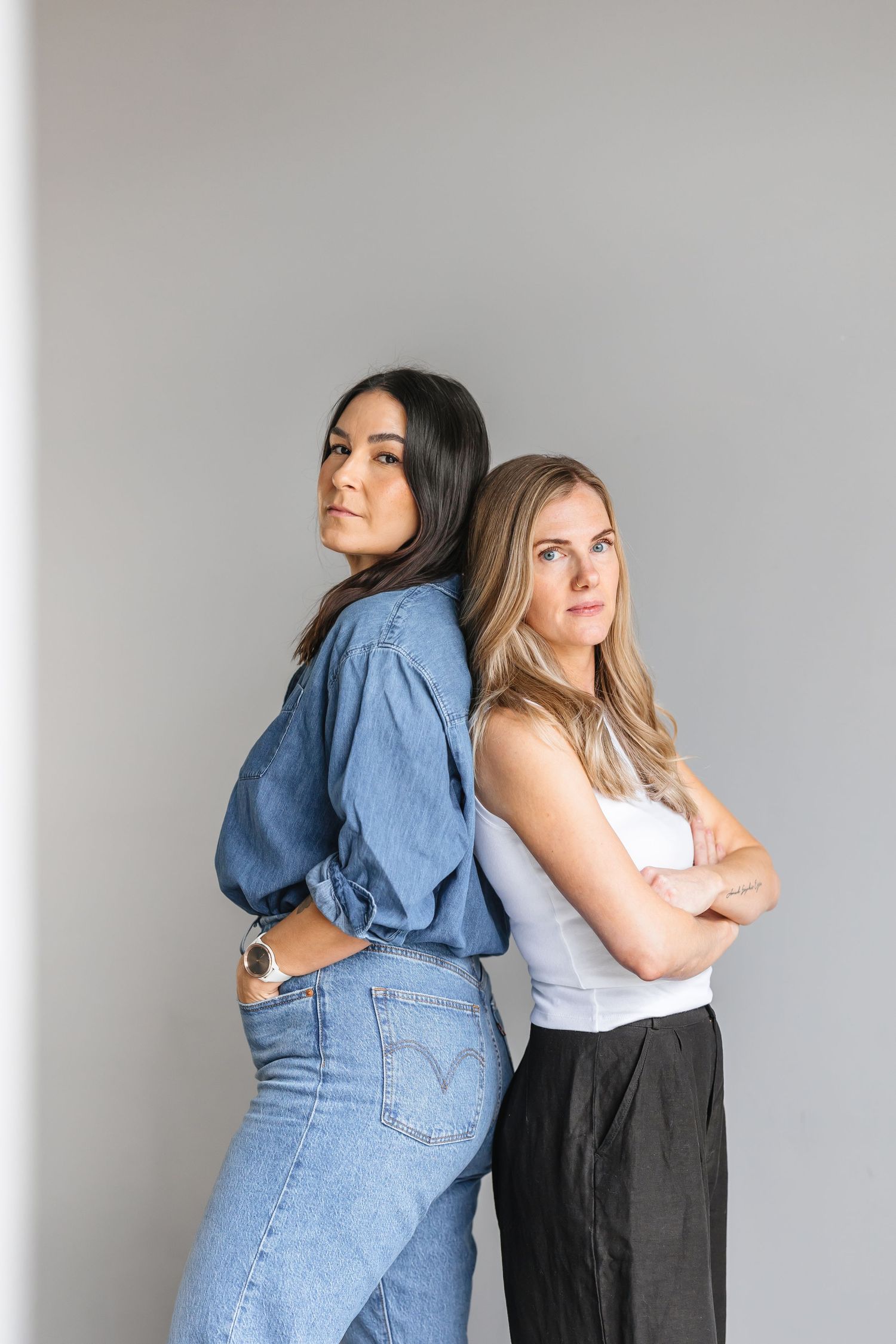 Two people pose together in a series of four photos showing playful friendship poses against a white background.