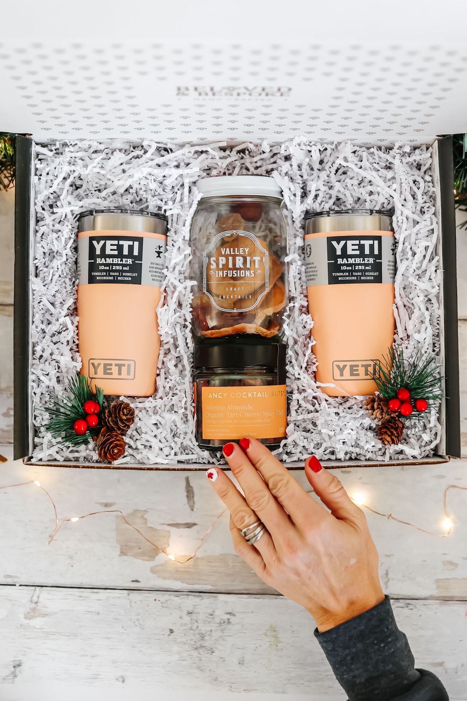 Yeti branded products displayed in gift box with decorative packaging and lighting.