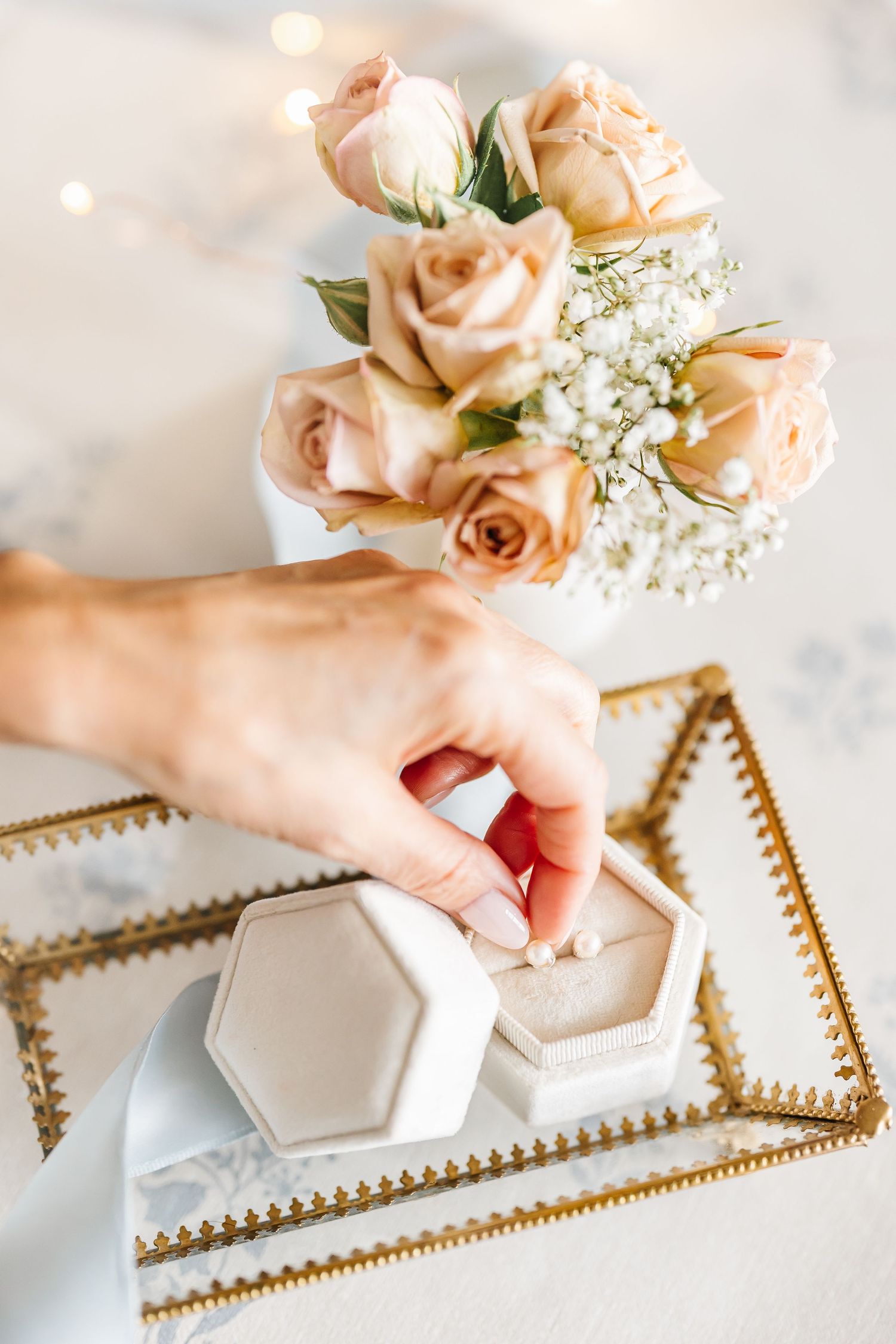 Close up of earrings and roses during a styled lifestyle branding photoshoot in Kelowna, BC