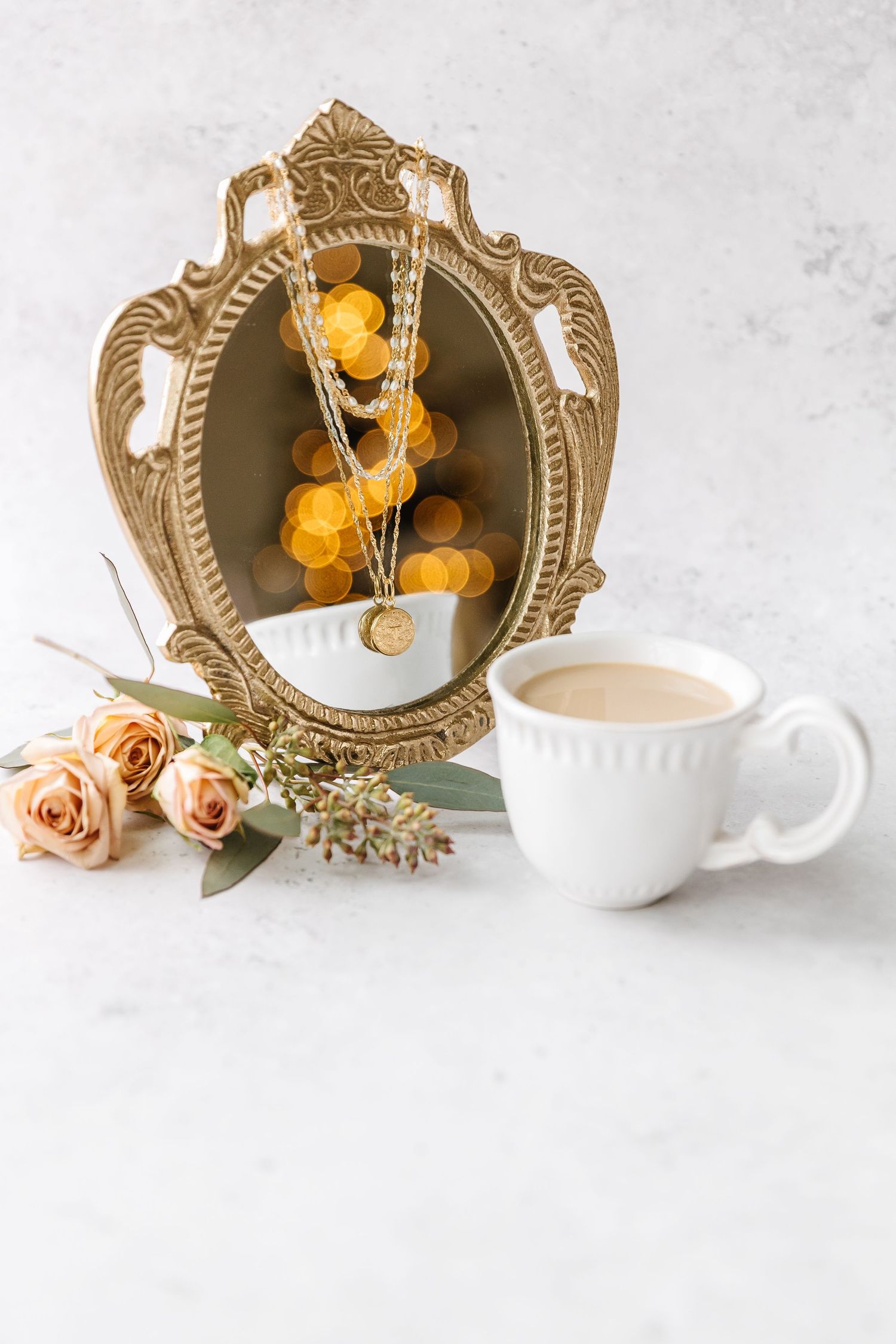 Indoor branding photography session of a necklace and products with backdrop in the Okanagan