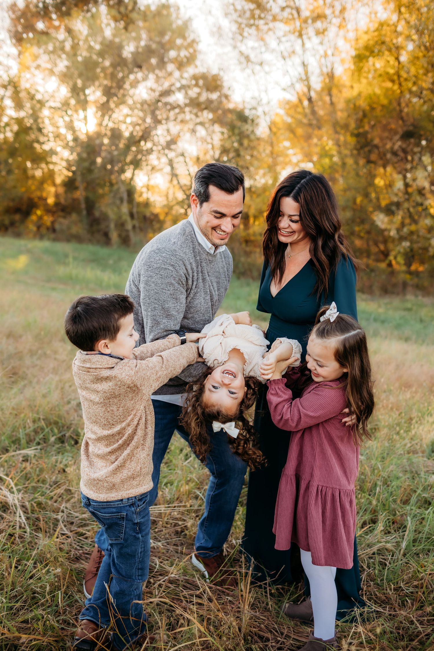 New Haven, CT family laughing on bridge in photography session