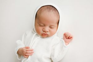 vintage bonnet on newborn baby