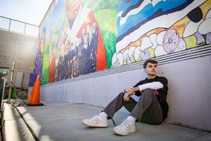 Four sequential photos of colorful graffiti murals on urban walls with skateboarding action in progress.