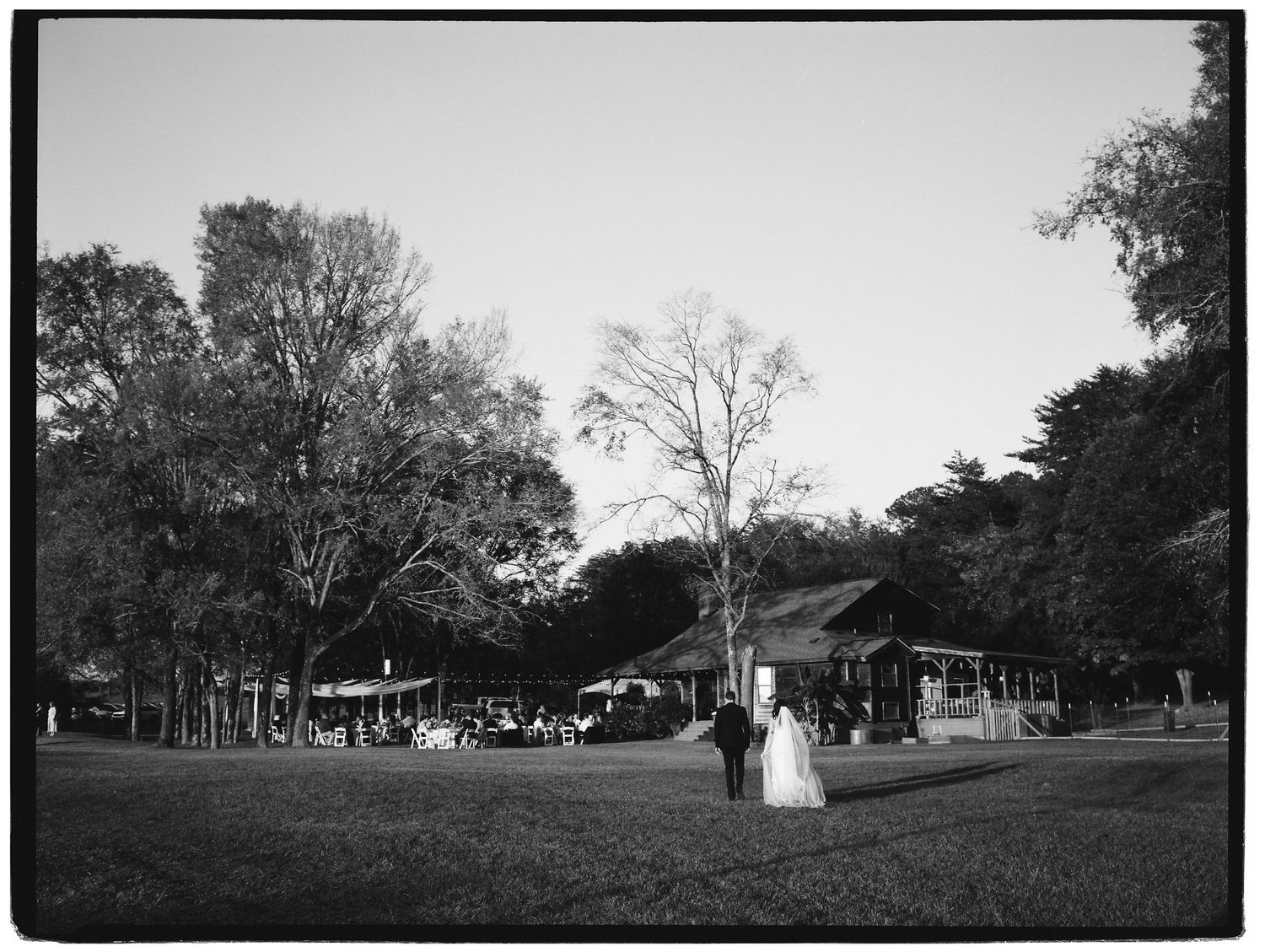 Black and white panoramic view of wedding ceremony setup on sprawling outdoor grounds.
Film, Authentic, Cinematic photographer, Film Photo
