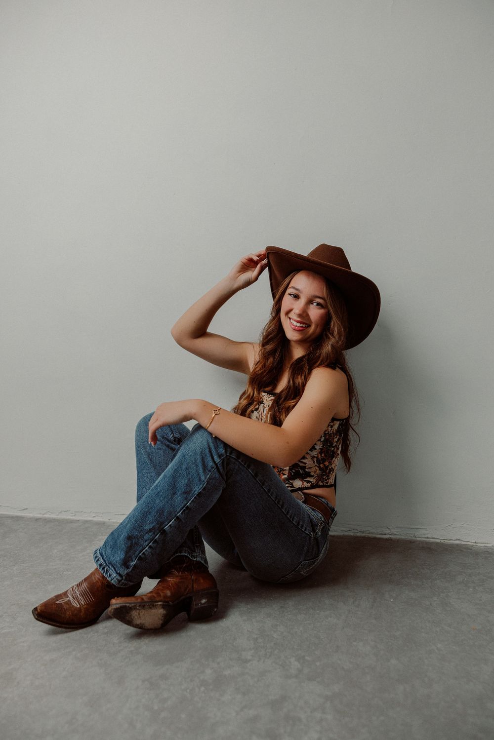 Modern senior studio photos featuring bold posing and a luxury aesthetic