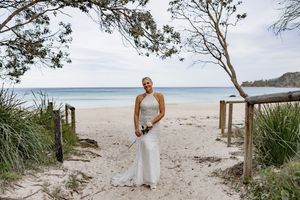 A series of beachside photos showing sandy paths and coastal vegetation leading to a pristine white sand beach.