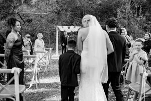 A black and white photo montage showing candid moments at an outdoor social gathering with people interacting.