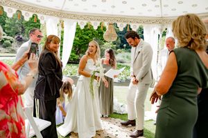 A wedding celebration montage showing guests and couples dancing and mingling at an outdoor reception venue.