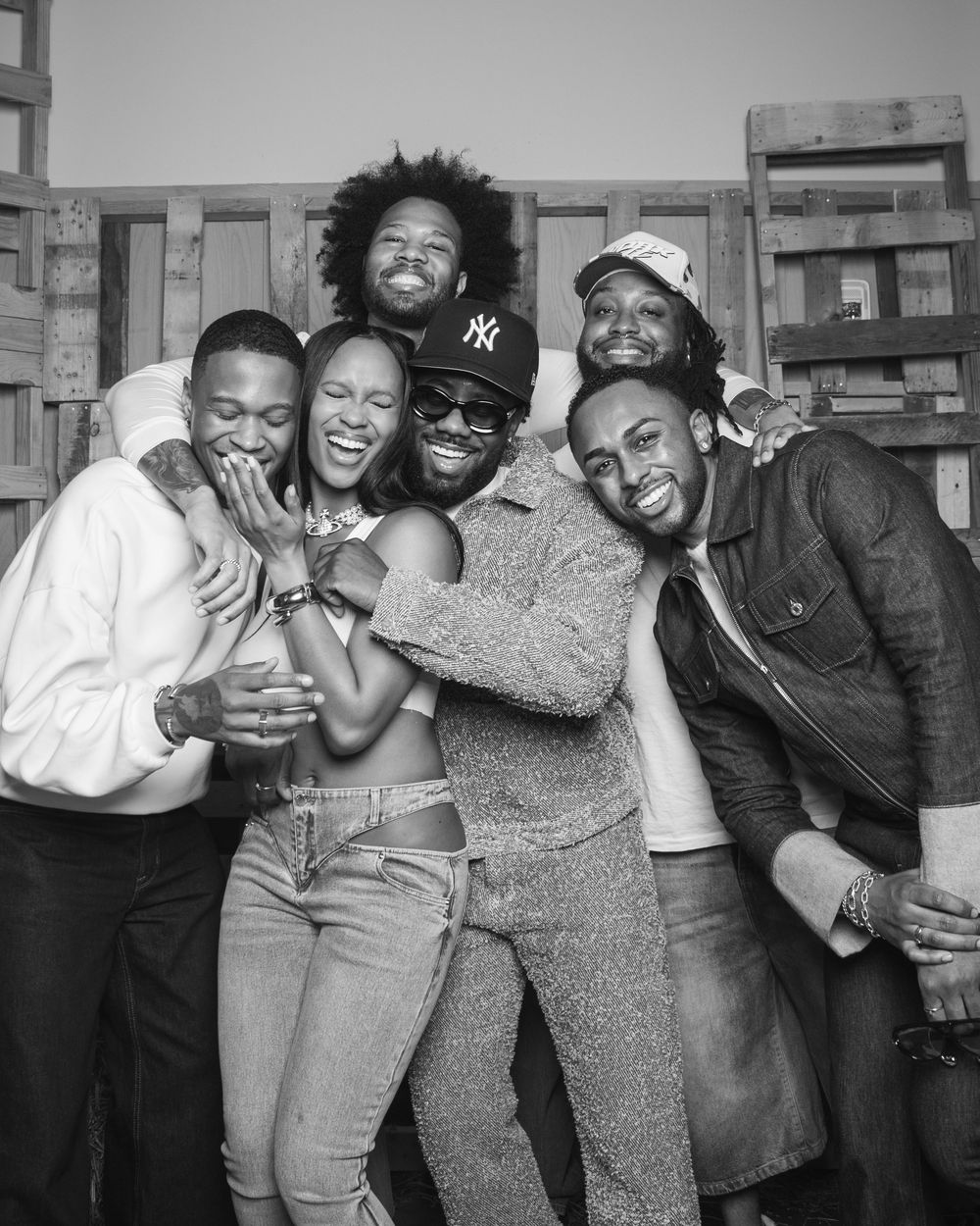 A black and white photo series showing a group of friends laughing and embracing in candid moments.
