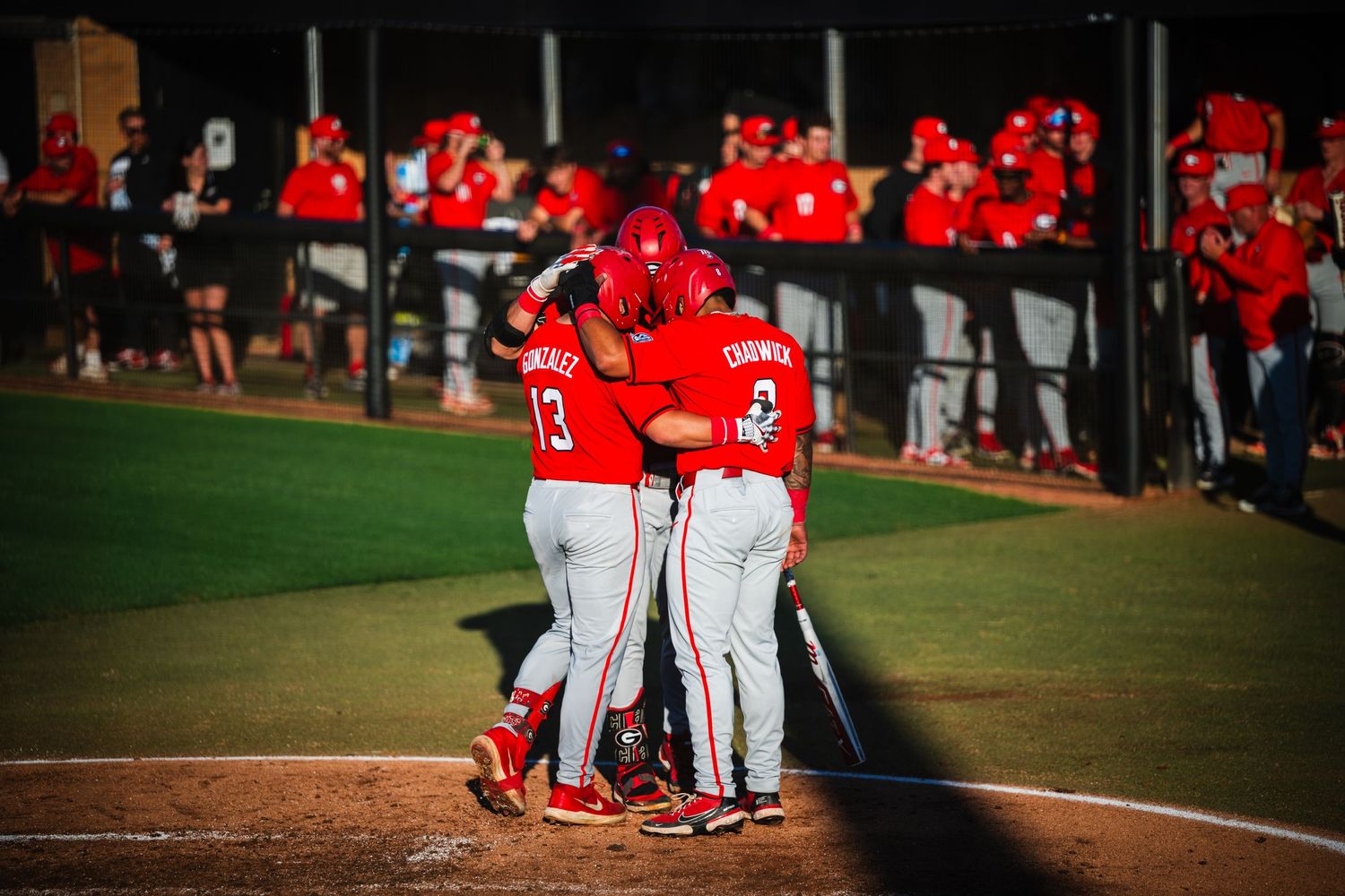 GA baseball team huddles together
