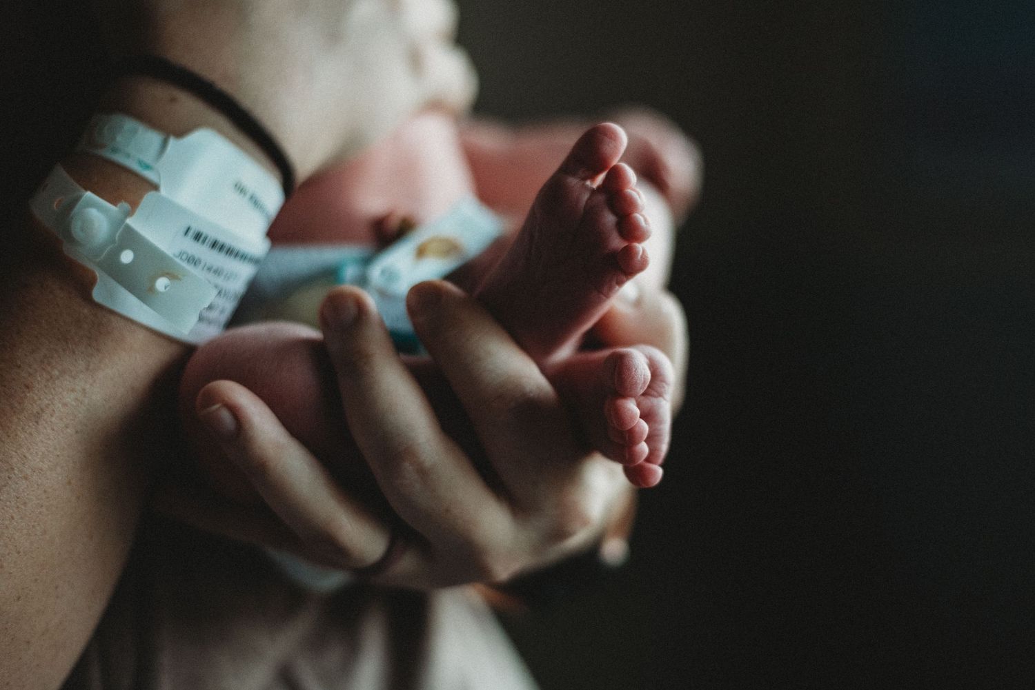 Close-up of newborn toes during a cozy, in-home session in Dickinson, ND - lifestyle newborn photographer serving Dickinson, ND