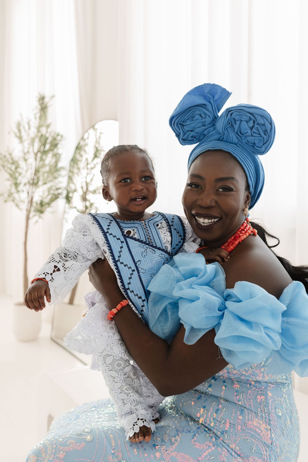 Toronto mom and baby smile in traditional Nigerian clothing at mint room, captured by Toronto Family Photographer Jess GC Photography