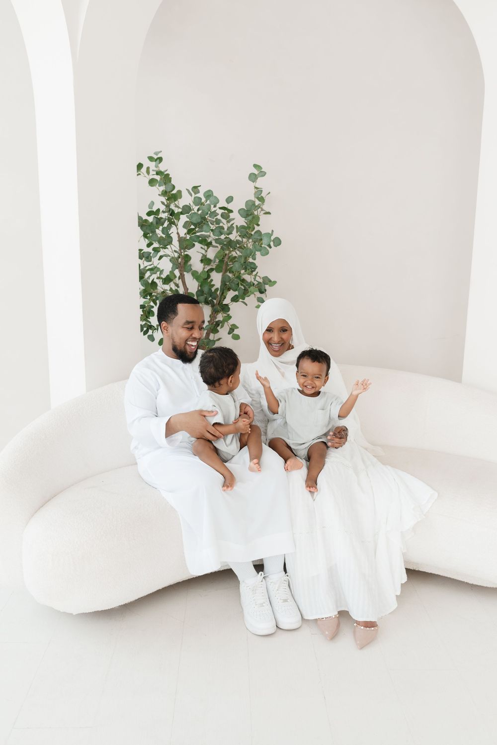 Family with twin boys captured at mint room studios, natural photos in candid style taken by Toronto Family Photographer Jess GC Photography