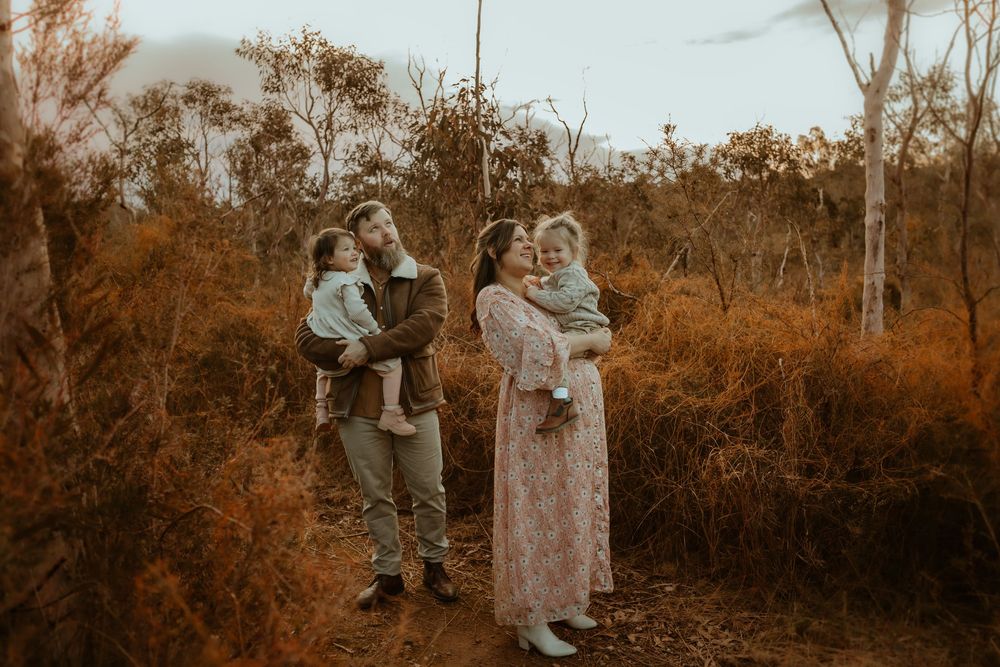 A series of vintage sepia photographs showing couples embracing in a natural outdoor setting.